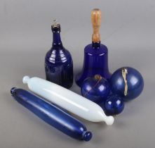 A quantity of blue glassware including large glass bell with turned wooden handle, glass rolling