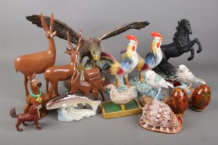 A quantity of animal figures including The Juliana Collection horse, eagle figure, souvenir
