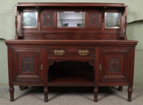 Early 20th century mirror back oak sideboard with central drawers above dog kennel storage area