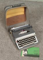 A 1960s Remington Monarch portable typewriter.