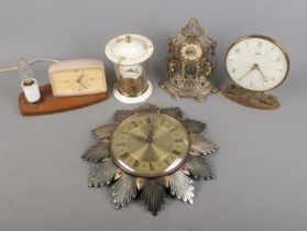 A collection of assorted clocks to include Metamec sunburst wall clock, Smiths 8 Day Floating