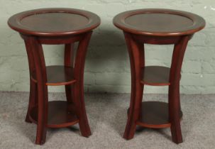 A pair of mahogany side tables with removable tray tops