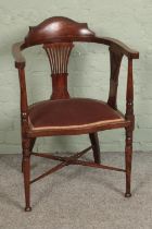 An early 20th century mahogany inlaid armchair Repair to centre of back rest and signs of repairs