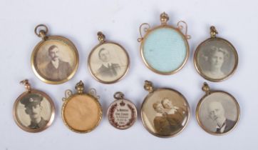 Nine yellow metal photograph lockets. Includes military example, King Edward Memoriam etc.