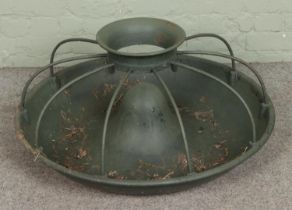 A painted cast iron Mexican hat pig feeder. Approx. diameter 87cm.