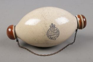 A Victorian stoneware Queens patent muff warmer with inscription