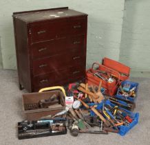 An oak chest of drawers with contents of tools. Includes chisels, Thor hammer, drill bits,