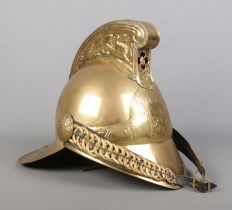 A brass Merryweather fire helmet for the NSW Fire Brigade.