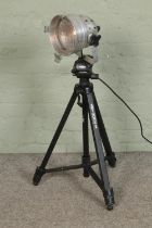 A studio light on a IQ video 300v camera stand.