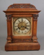 A German mantel clock in an oak case manufactured by HAC (Hamberg American Clock Company) with