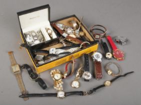 A box of ladies and gents quartz and manual wristwatches. Includes Sekonda, Lorus, Timex etc.