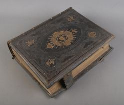 A leather bound Brown's self-interpreting family bible, containing the old and new testaments.