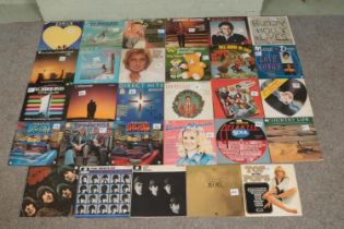 A collection of mainly rock and pop vinyl records, to include The Beatles, Michael Jackson, Diana