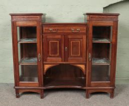 An Edwardian inlaid mahogany breakfront side cabinet.