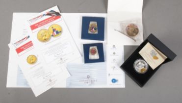 A quantity of commemorative coins. Includes a cased London Mint Office silver proof World War One