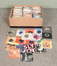 A box of assorted vinyl singles of mainly pop and rock to include Madonna, Prince, Eurythmics,