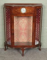 An Art Deco display cabinet with inset Smith's clock to centre panel. Hx105cm Wx88cm Dx29cm