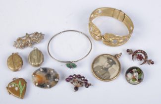 A collection of antique jewellery. Includes moss agate brooch, gilt metal bangle, lockets etc.