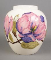 A Moorcroft Magnolia design on ivory background. Hx18cm Believed to originally be a ginger jar which