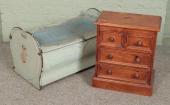 A vintage tin toy trunk produced by Northampton Metal Crafts Company together with a small pine