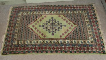 A large green wool rug 190x280cm