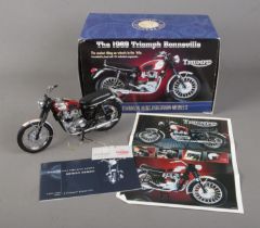 A boxed Franklin Mint 1:10 scale diecast model of The 1969 Triumph Bonneville.