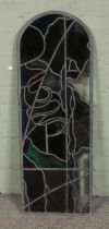 An arched leaded stained glass window. Approx. dimensions 34cm x 96cm.