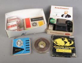 A box of assorted video recording equipment to include several tapes, Dixons Autocrat Enlarging