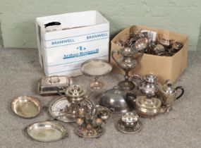 A large collection of metalwares mostly consisting of silver plate items such as teapots, sugar