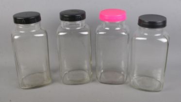 Four vintage glass sweet jars.
