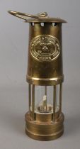 A Welsh brass miners lamp by E Thomas & Williams Ltd.