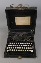A cased Remington Portable typewriter.