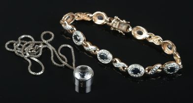 A silver gilt bracelet set with sapphire and diamond stones, along with a silver pendant on chain.