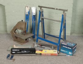 A collection of tools and accessories. Includes Burgess band saw, Rolson clamp, Work Zone air filter