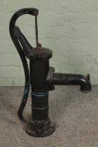 A cast iron water pump. Hx70cm approx