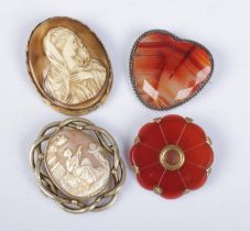 Four large antique brooches. Includes cameo and stone examples.