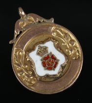A 9ct gold fob with enamel Lancashire Rose crest inscribed for Holbrook & Dist F.L Junior Winners