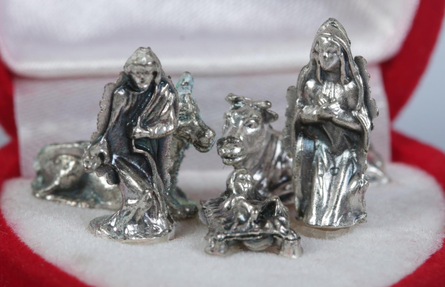 A cased miniature five piece white metal nativity scene. - Image 2 of 2