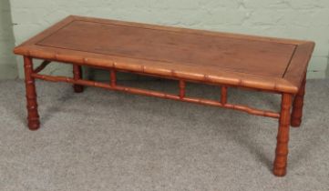 A carved Chinese hardwood bamboo effect coffee table Hx41cm Wx122cm Dx51cm