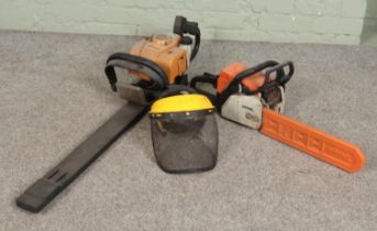 A Stihl petrol chainsaw along with a Tivoli 63 petrol hedge trimmer and Rocwood safety visor.