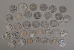 A collection of British, Gibraltar and Isle Of Man commemorative 50p and 20p coins.