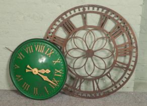 A large green clock with larger outdoor garden clock face (no mechanism). Green clock diameter 63cm,