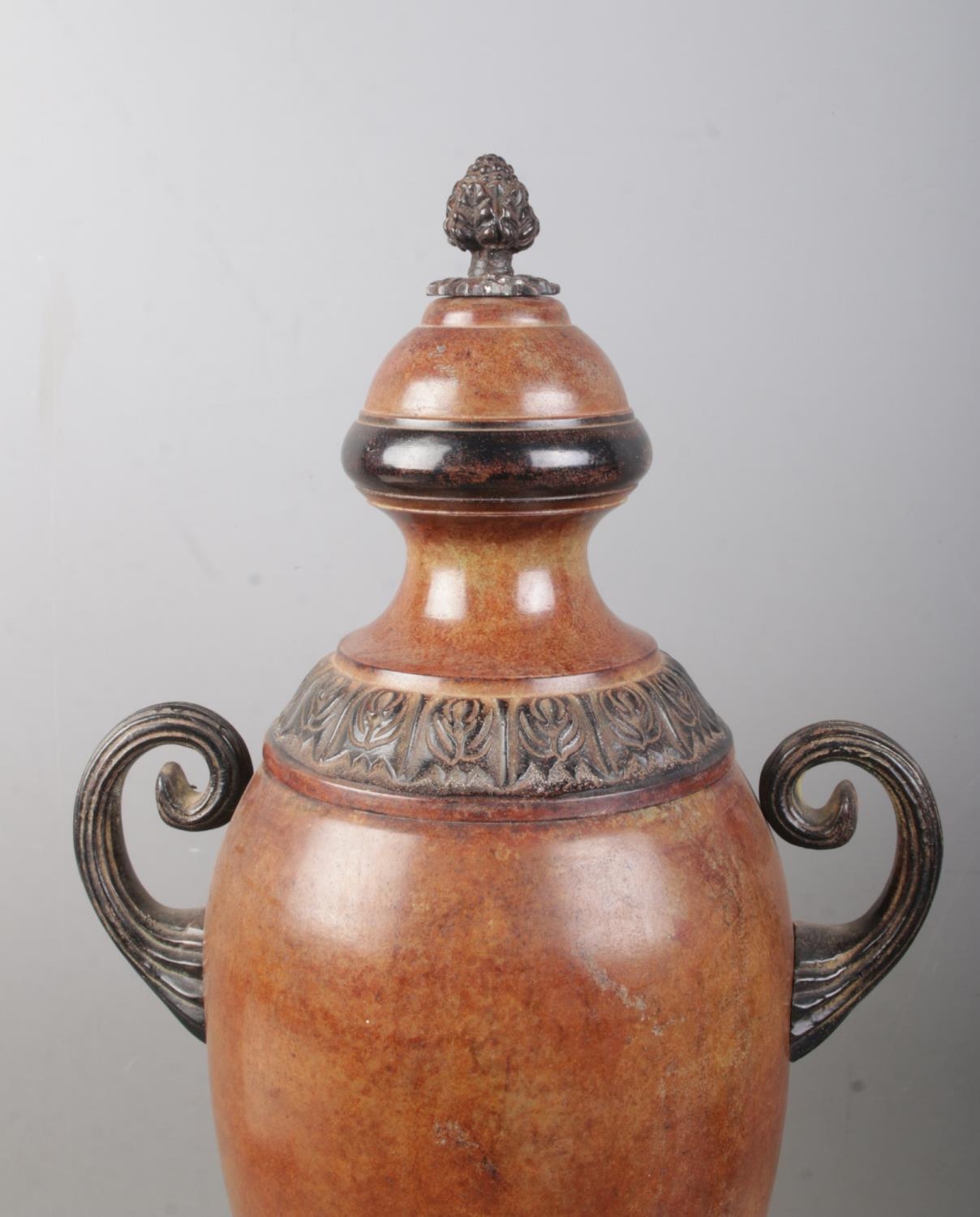 A near pair of bronzed twin handled globular shaped urns, with grape finial and banded floral border - Image 2 of 2