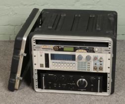 An SKB rack flight case containing Sanyo DCA 401 integrated Pre Main Amplifier, Akai S1000 Midi