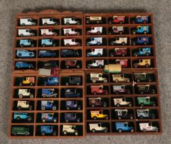 Four display cases containing a collection of Lledo promotional diecast figures.