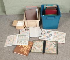 Two boxes of assorted international stamp albums both complete and partially complete. Includes