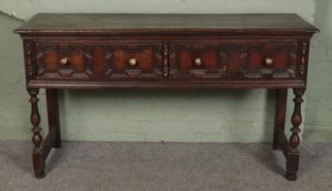 A 17th Century style oak geometric moulded dresser base/sideboard by Thomas Clarkson & Sons