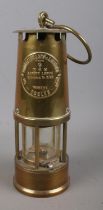An Eccles Type 6 brass miners lamp by The Protector Lamp & Lighting Co Ltd.