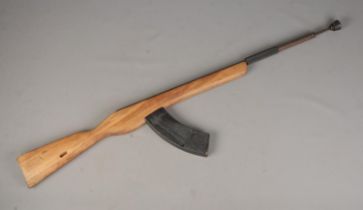 A bayonet training rifle with spring loaded "bayonet" barrel system.