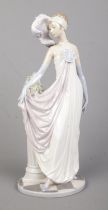 A Lladro ceramic figure; Socialite of the 20's, 5283. 34cm tall.